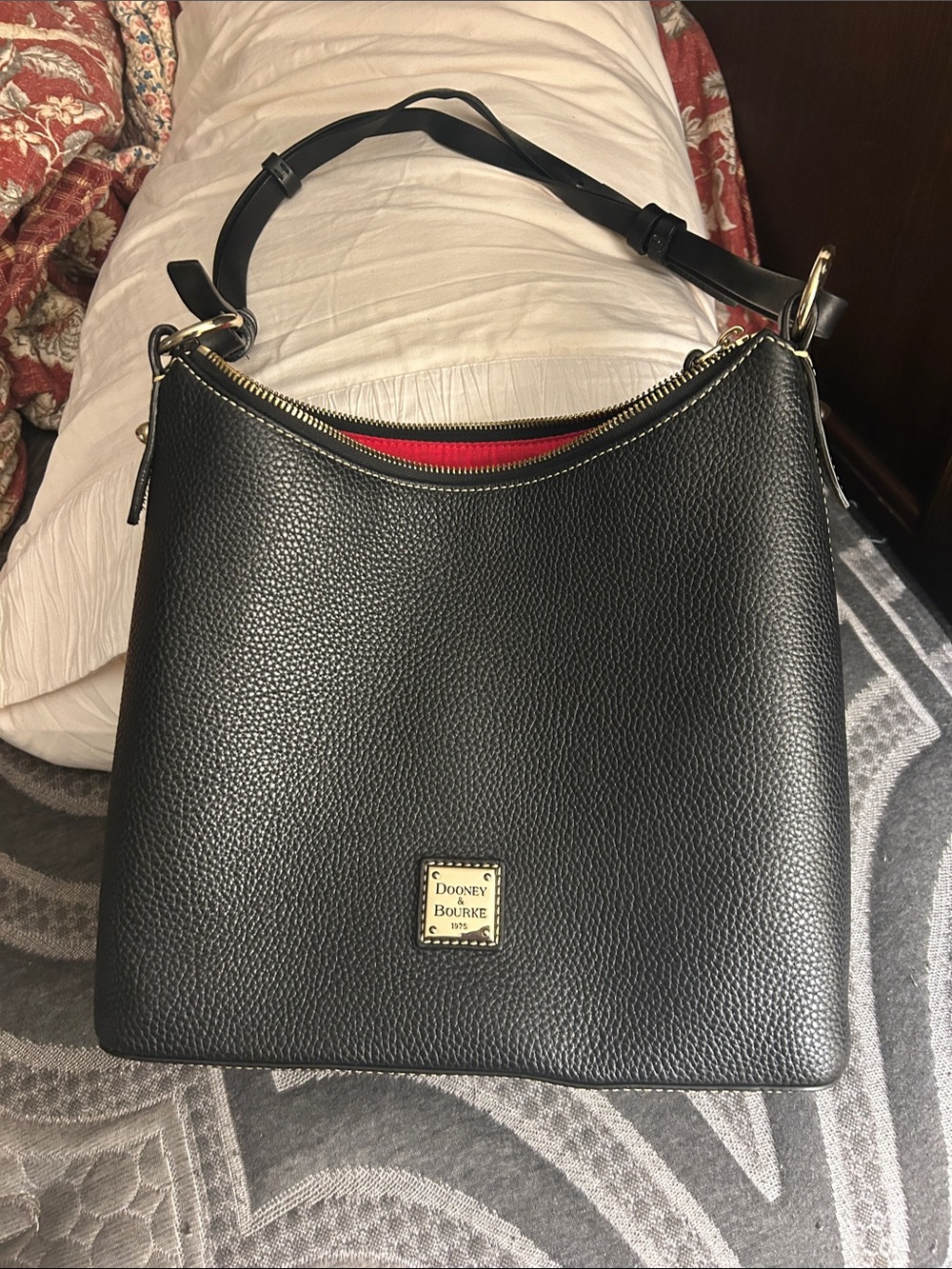 Dooney & Bourke Black Pebbled Leather Shoulder Bag with Red Interior Accents